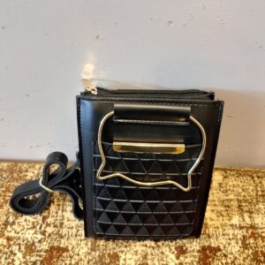 Chic Black Handbag with Unique Gold Handle and Dual Zips