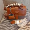 Imported Brown Crossbody Bag with Scarf-Wrapped Handle and Mini Bag Charm